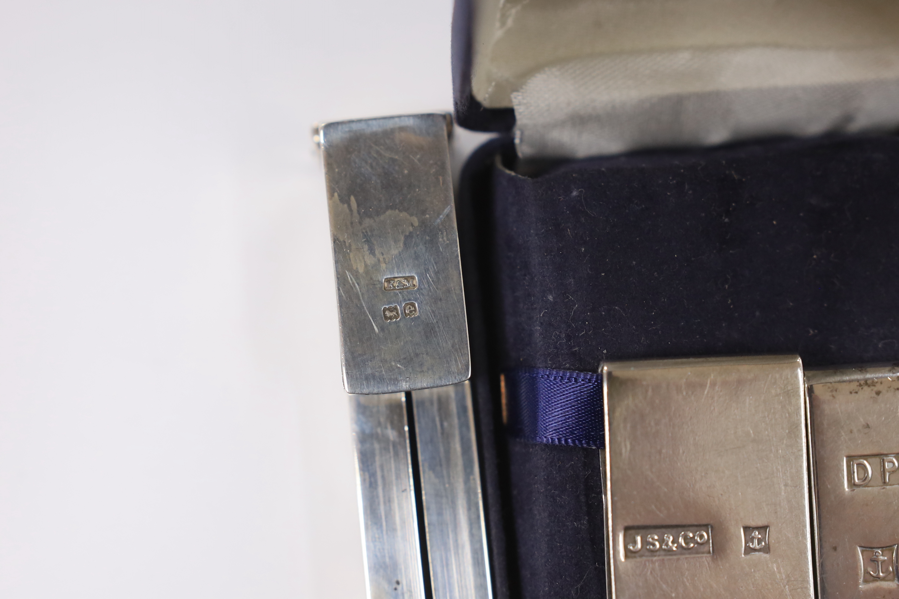 An Edwardian silver propelling wax seal dispenser/vesta, Birmingham, 1904, 13.7cm, two modern silver money clips and a Yard-O-Lead pencil.